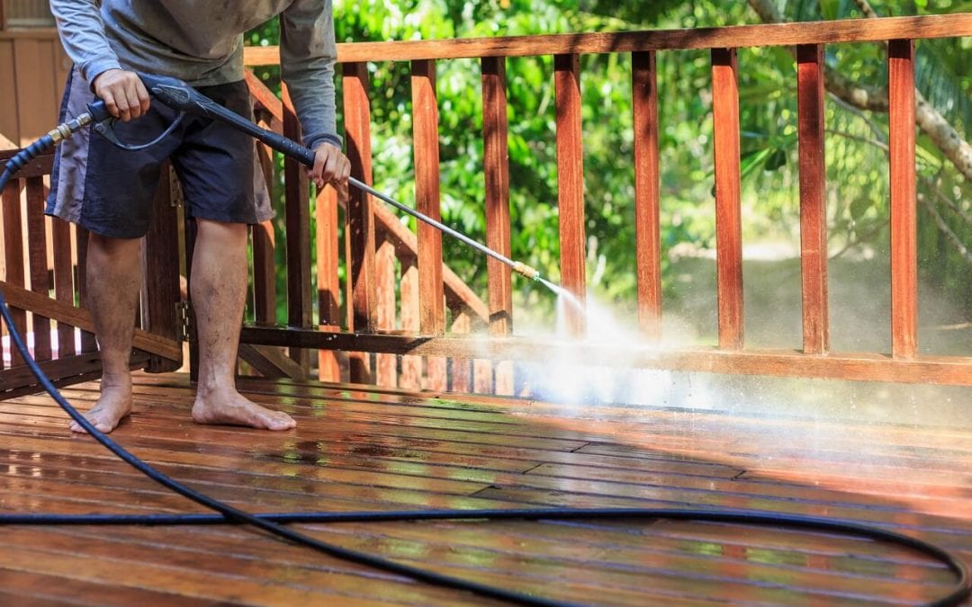 summertime home maintenance includes washing the deck